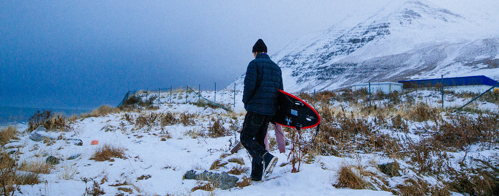 Man in snow with warm jacket