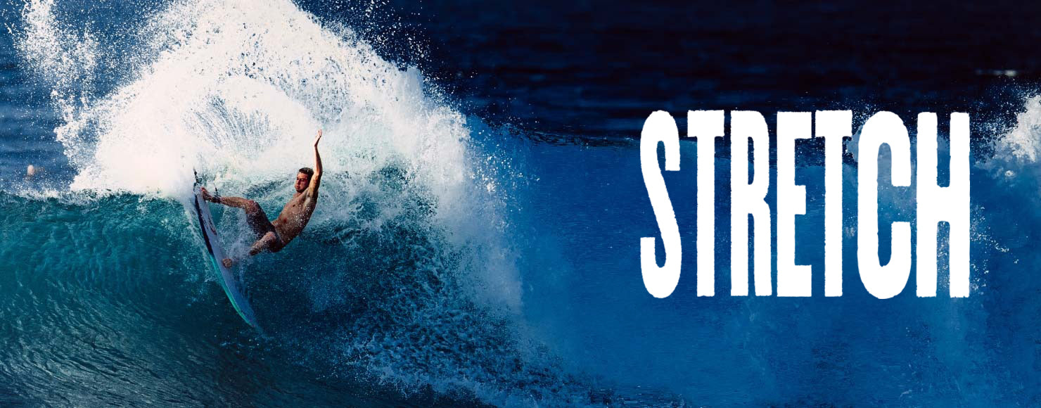 Surfer riding a wave with 'STRETCH' text overlay