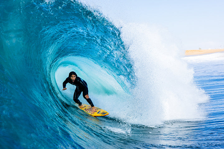Surfer riding wave