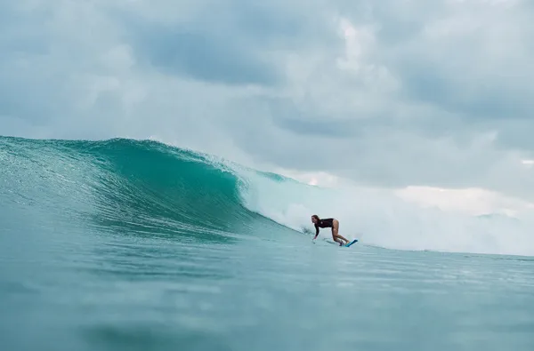 Steph Gilmore riding a huge wave