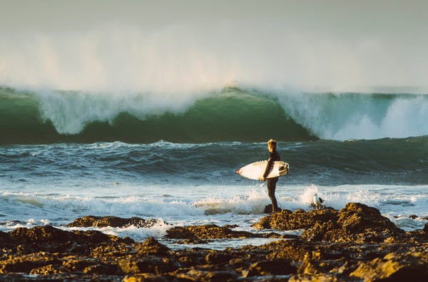 beautifull landscape of ocean with a surfer