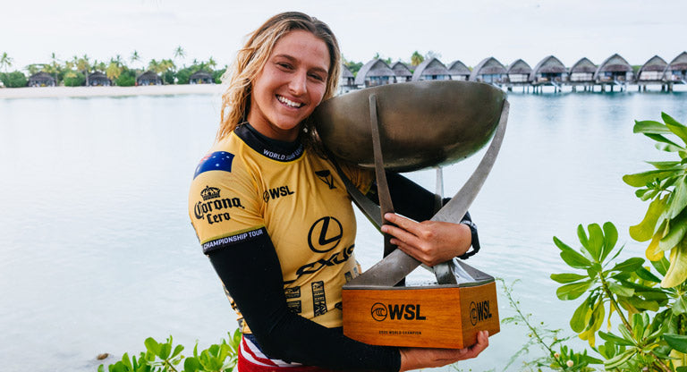Molly Picklum holding her 2025 World Surfing championship trophy
